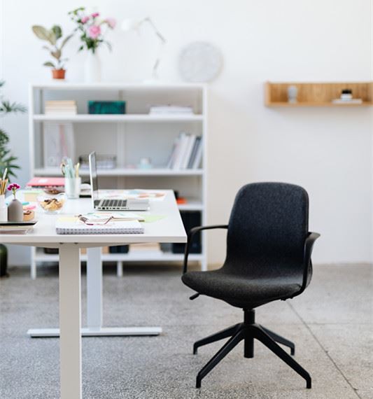 Canva - Black Office Rolling Chair Beside White Wooden Table_ Canva - Black Office Rolling Chair Beside White Wooden Table_